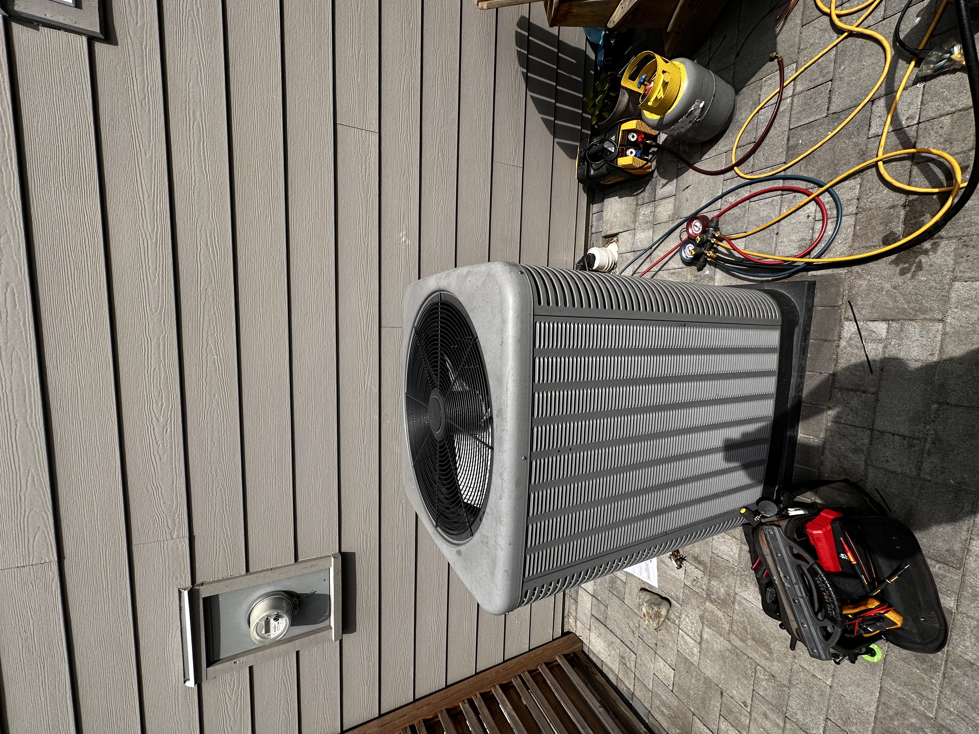 Outdoor heat pump unit on a customer's deck